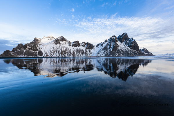 Vestrahorn mountain with water reflection in Hornsvik bay, Austurland, south-east Iceland