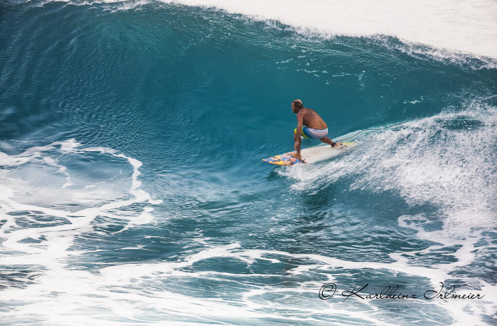 Surfer in Napili Bay, West Maui, Hawaii